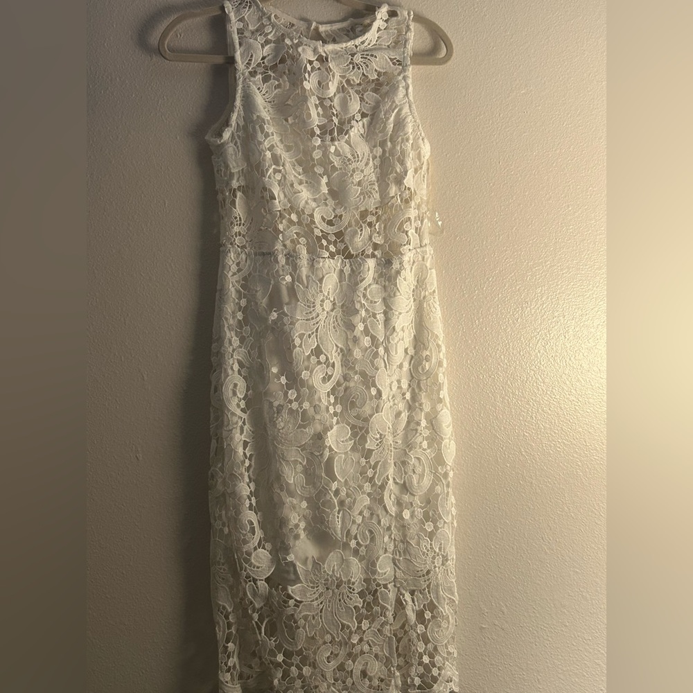 New, without tags. Never worn. White, summer style lace dress. Mid length.